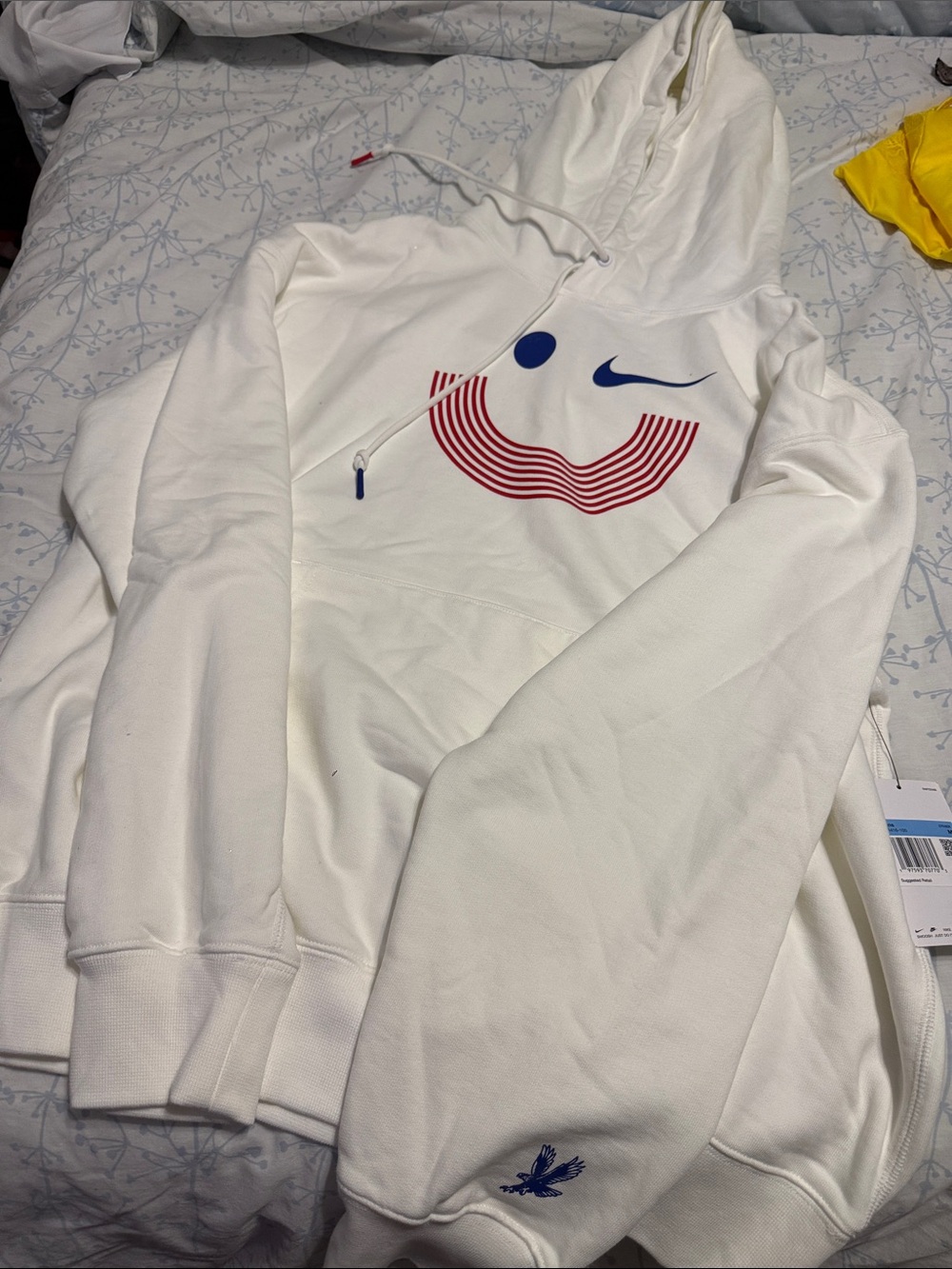 Nike White Hoodie with Red Smiley Stripes and Blue Accents